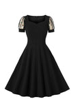 Robe noire swing des années 50 à manches courtes