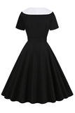 Robe swing noire des années 50 avec ceinture