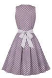 Robe à pois violet des années 50 avec ceinture