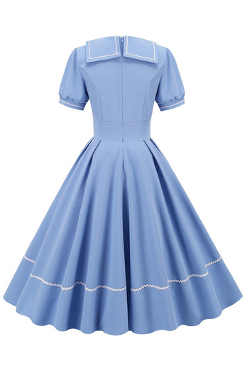 Robe bleue des années 50 de style rétro avec manches courtes