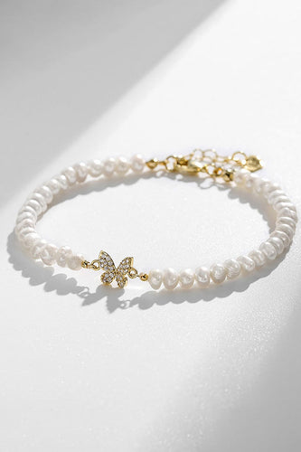 Bracelet de perles d’eau douce de culture blanche avec papillon en strass