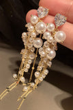 Perle d’or longues boucles d’oreilles