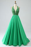 Robe de soirée dos nu vert satiné avec perles