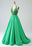 Robe de soirée dos nu vert satiné avec perles