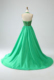 Robe de soirée dos nu vert satiné avec perles