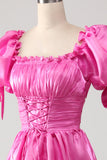 Robe de bal rose vif à manches bouffantes avec volants